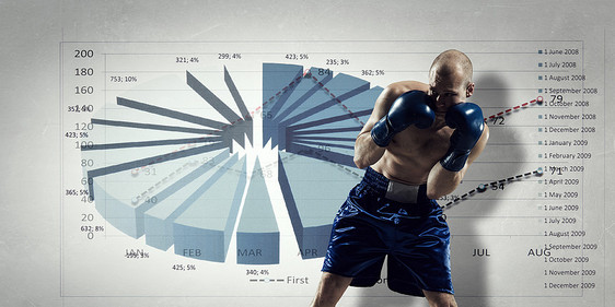 为销售动态而战肌肉拳击手男子黑暗的背景与图表图片