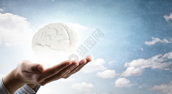 心理健康靠近人类的手,握住大脑图片