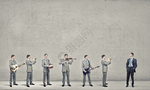 个男人乐队穿西装的男子管弦乐队演奏同的乐器图片