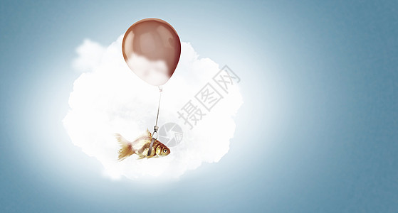 金鱼气球上飞翔气球上飞着金鱼的超现实主义图片