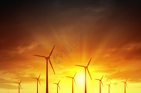 日落背景下的风车替代电力的替代风能背景图片