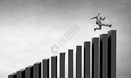 上职业阶梯轻的商人楼梯上奔跑,代表着成功的图片