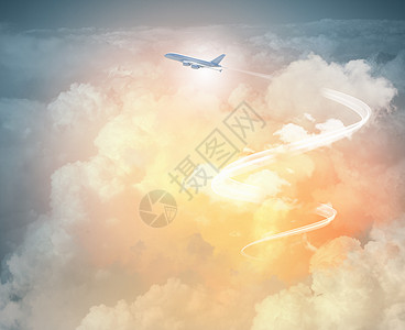 飞机天空中的形象空中飞行飞机的图像,背景为云图片