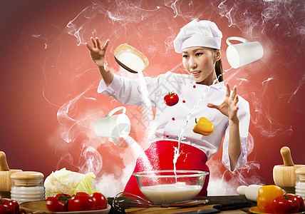 亚洲女烹饪与魔术的颜色背景图片