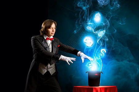 戴帽子的魔术师巫师用帽子表演魔术的形象货币背景图片