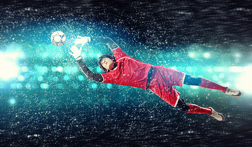 守门员接住了球守门员接住了球体育场,聚光灯下图片素材