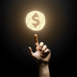 美元人类手指指向黑色背景上的美元标志图片