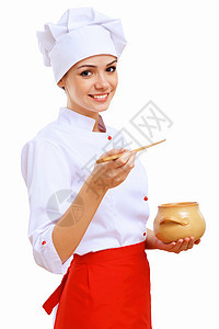 年轻的厨师穿着红色围裙准备食物图片