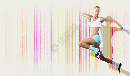 运动女跳跃的形象运动女孩彩色背景下跳跃的形象图片