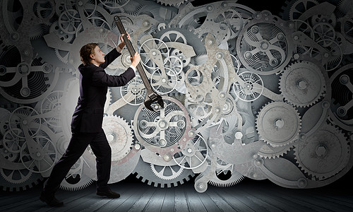 机电背景图工作机制轻的商人用扳手固定齿轮机构背景