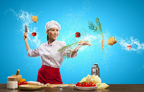 带刀的亚洲女厨师亚洲女厨师用刀子空气中切割水果蔬菜图片