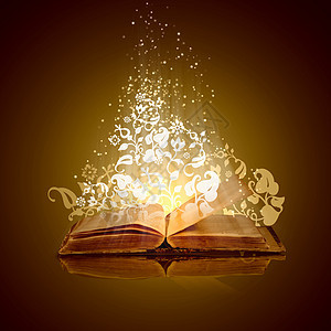 魔法书用魔法灯打开魔法书的图像图片