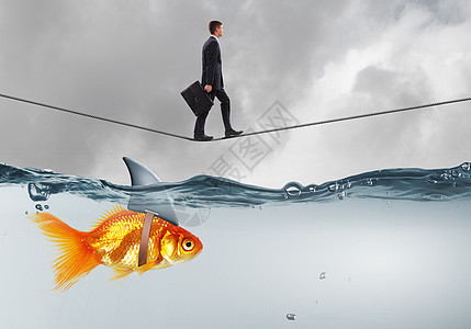 当商人鲨鱼水上的绳子上行走时,假威胁的似乎金鱼为你的生意冒虚假风险图片