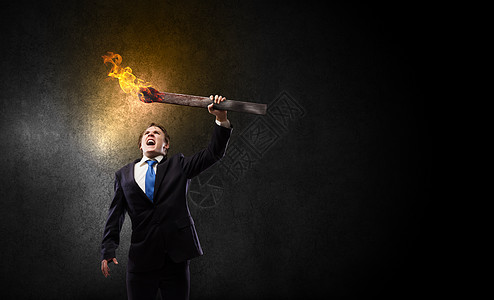 中国风还把带着火把的人轻的商人手里着燃烧的火炬背景