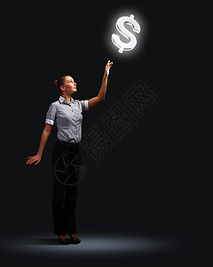 商务女性指着发光的货币符号图片
