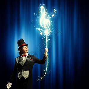 戴帽子的魔术师男子魔术师的形象,魔术与颜色背景图片