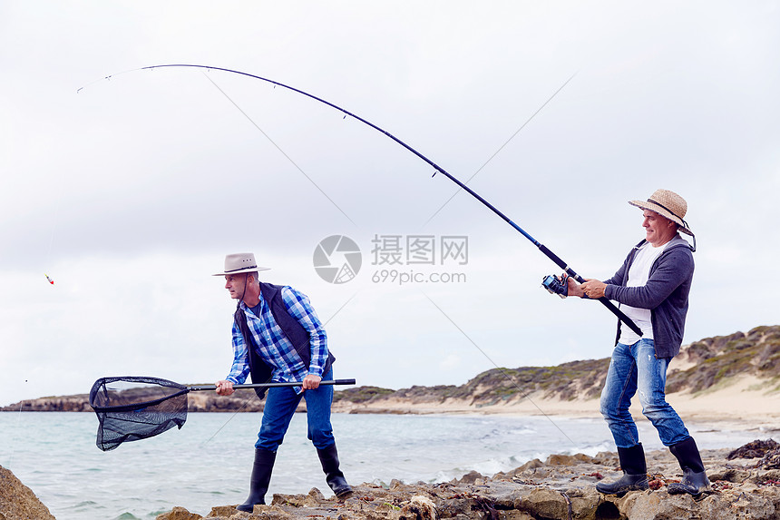 渔夫的照片渔民用鱼竿捕鱼的照片图片