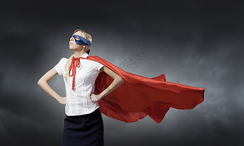 穿着超级英雄服装的轻自信的女人背景图片
