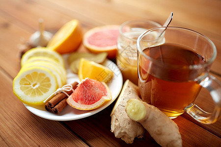 健康,传统医学,民间补救民族科学杯姜茶与蜂蜜,柑橘肉桂木制背景图片