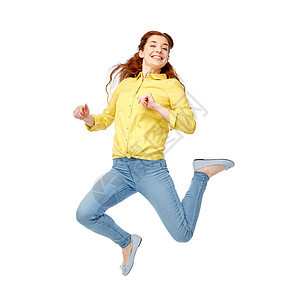 幸福,自由,运动人的微笑的轻女人空中跳跃图片
