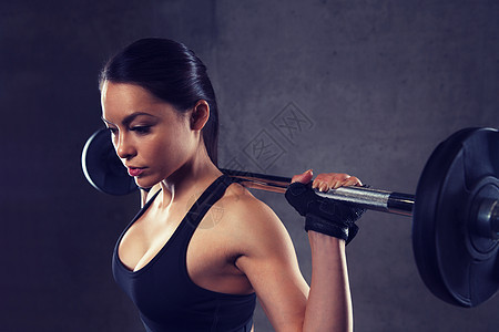 运动,健身,健美,举重人的轻妇女杠铃弯曲肌肉健身房轻女子健身房用杠铃弯曲肌肉图片