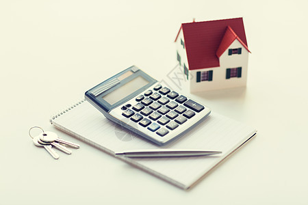 抵押贷款,房地产财产家庭模型,房子钥匙,计算器笔记本与笔家庭模型,计算器笔记本图片