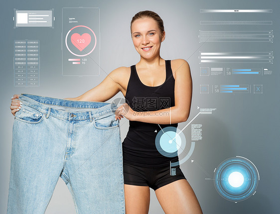 饮食,健身技术轻的苗条运动妇女减肥结果与她的大尺寸裤子轻的苗条运动女人展示大尺寸的裤子图片
