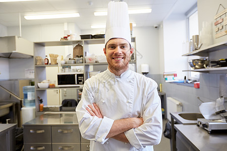 烹饪,职业人的快乐的男厨师餐厅厨房用交叉的手饭快乐的男厨师餐厅厨房饭图片