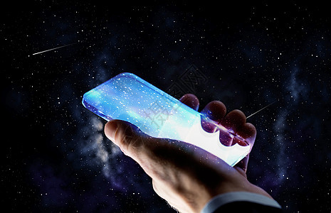 商业,人未来的技术密切的商人与透明智能手机背景上用璃智能手机手图片