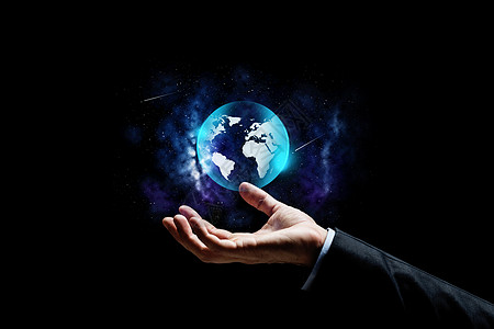 商业,人未来的密切的商人与地球投影背景用地球投影拉近商人的手图片