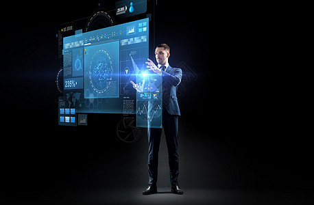 商业,增强现实,人未来的技术商人适合与虚拟屏幕投影黑色背景穿着虚拟投影西装的商人图片