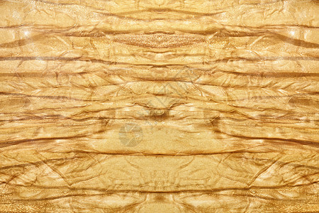 金色旧皱褶物观的纹理图片