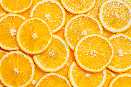 彩色橙色柑橘类水果片背景顶部视图五颜六色的橙色水果片图片