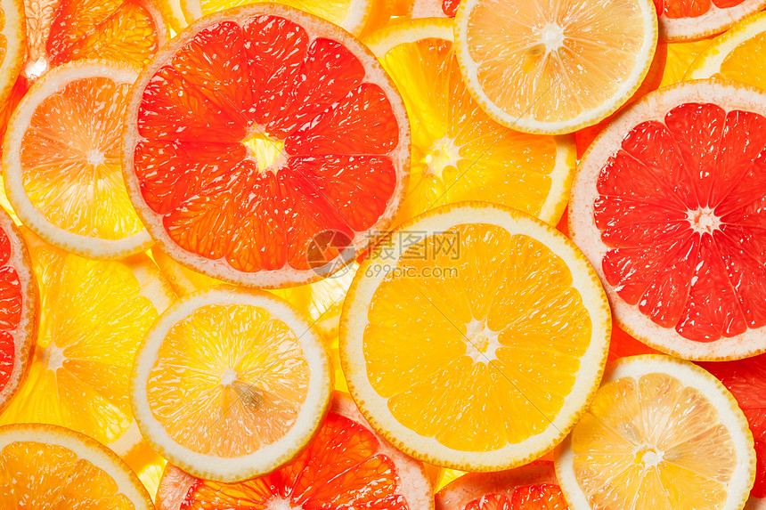 彩色柑橘类水果柠檬,橘子,柚子片背景背光图片