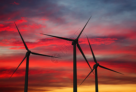 绿色可再生能源日落时天空中的风力发电机涡轮机空中的风力发电机涡轮机图片