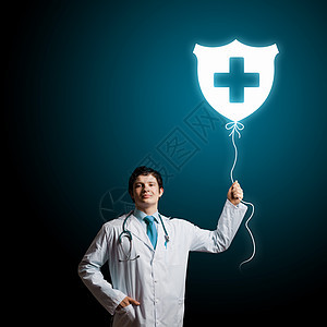 男医生轻的男医生着带医疗标志的气球健康警卫图片