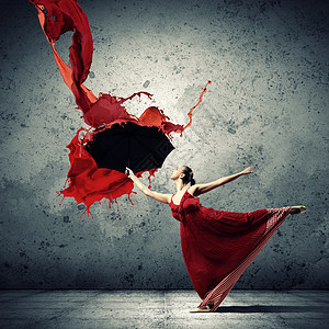 芭蕾舞穿着带伞的飞缎连衣裙芭蕾舞穿着飞缎连衣裙,油漆下带着雨伞图片