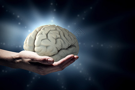 心理健康靠近人类的手,握住大脑图片