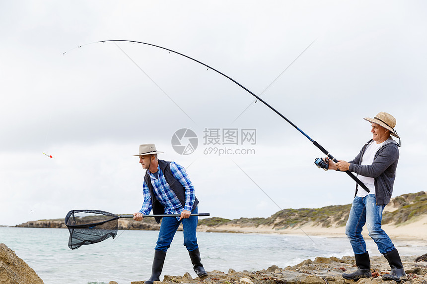 渔夫的照片渔民用鱼竿捕鱼的照片图片