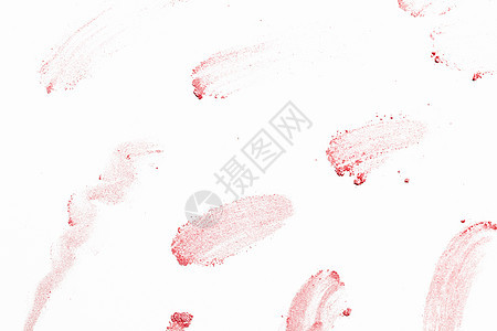 散落的粉末白色背景上粉红色粉末的抽象图像图片