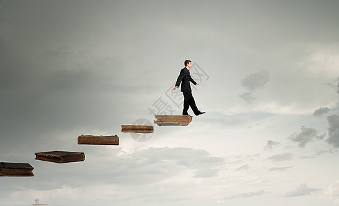 书籍阶梯知识成功的关键商人走用书的职业阶梯上背景