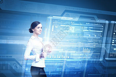 用现代技术的妇女高科技蓝色背景的平板电脑的女商人图片