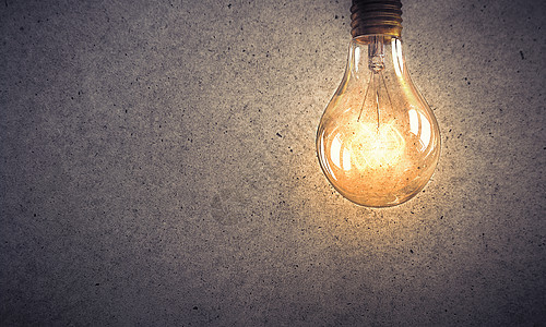 石头表的灯泡电源能源与璃发光灯泡混凝土背景背景图片