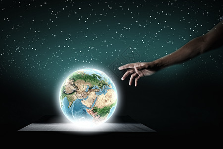 触摸地球地球行星用手指近距离接触地球行星这幅图像的元素由美国宇航