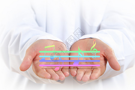音乐用音乐音符数字特写人类的手图片