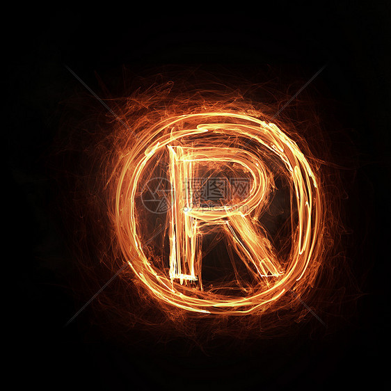 消防版权图标发光的火版权标志黑暗的背景图片