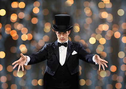 魔术,表演,马戏,人表演魔术师顶帽展示技巧近光灯背景图片