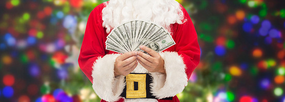 诞节,假日,胜利,货币人的诞老人与美元的钱灯光背景图片