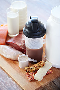 运动,健身,健康的生活方式,饮食人的密切天然蛋白质食品添加剂木制桌子上图片