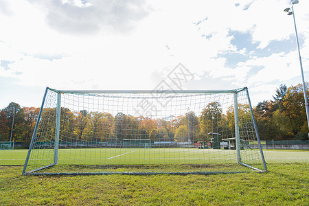 运动设备球场上的足球进球球场上的足球进球背景图片